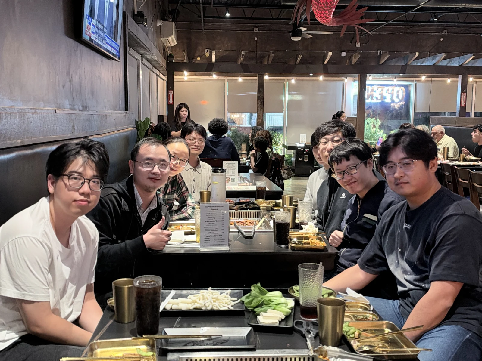 Bai Group members sharing a meal together